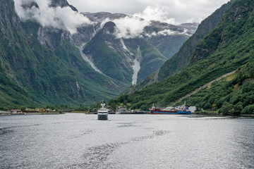 Fototapeta na wymiar Sognefjord sea landscape, Norway. Ship sailing in mountains.