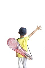 A young boy with badminton equipment on his back isolated on white background