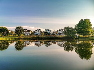 Fototapeta premium Darulaman Lake in Jitra, Kedah, Malaysia is a perfect place to enjoy a cool evening just paddling in the lake or riding the buggies around. It is a very good place for boating and relaxation. 