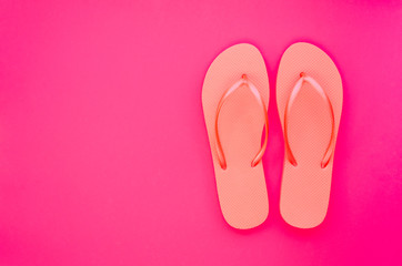 Summer minimal mockup with copy space on pink and beach flip flops