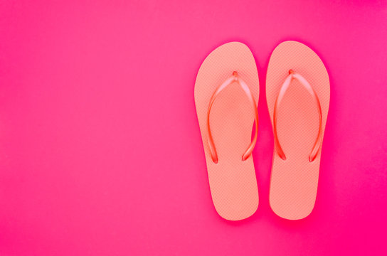Summer minimal mockup with copy space on pink and beach flip flops