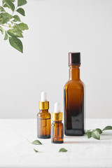 Bottles with aroma oil, medicines on wooden background. Selective focus,horizontal.
