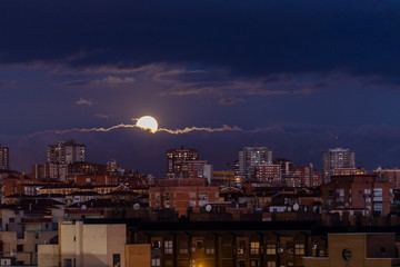 Naklejka premium First full moon of the year 2020 over the Madrid skyline