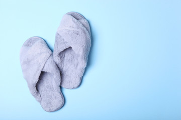 slippers on a colored background top view.