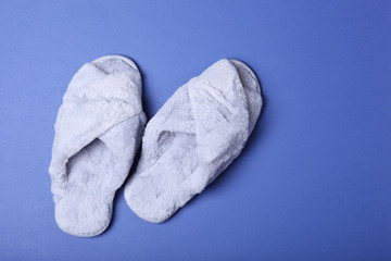 slippers on a colored background top view.