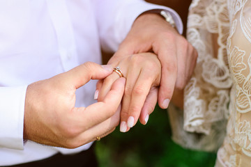 Wedding engagement rings. Newlywed couple's hands with engagement rings.