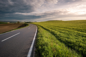 roadtrip with dramatic sky and a unknown destination