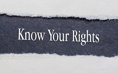 Rip Blue Paper and white background with know your rights written on