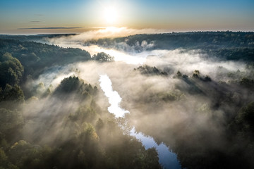 Wonderful mist over river at sunrise, aerial view