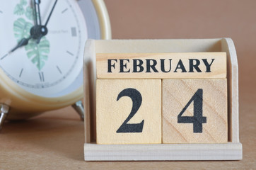 February 24, Cover design with clock in natural concept.