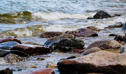 sea shore, stones on the shore, close-up, blurred background