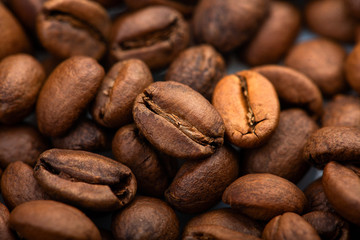 Coffee beans close-up background. Fresh roasted