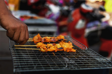 Pictures of grilled squid vendors on the street