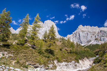 bright blue sky near a glacier in the alps at the dachstein glacier look into a valley of hiking trails