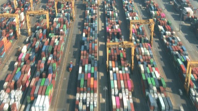 Aerial hyperlapse of a busy seaport container yard