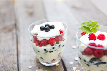 Natural yogurt with fresh raspberries, black currant and muesli.