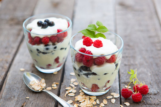 Natural yogurt with fresh berries and muesli.