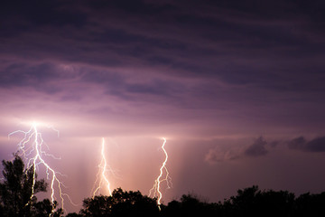clouds and thunder lightnings and storm on the dark cloudy sky