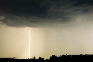 clouds and thunder lightnings and storm on the dark cloudy sky