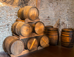 Ancient castle, wooden barrels in winery room