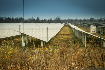 Sun batteries energy stands in the field