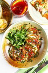 An exquisite culinary dish on a white table. Restaurant serving.