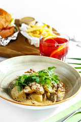 An exquisite culinary dish on a white table. Restaurant serving.