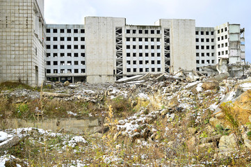 Remains of the destroyed industrial building. Background