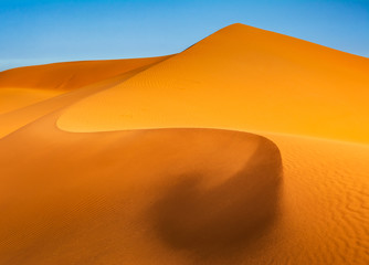Fototapeta na wymiar Amazing view of sand dunes in the Sahara Desert. Location: Sahara Desert, Merzouga, Morocco. Artistic picture. Beauty world. Travel concept.