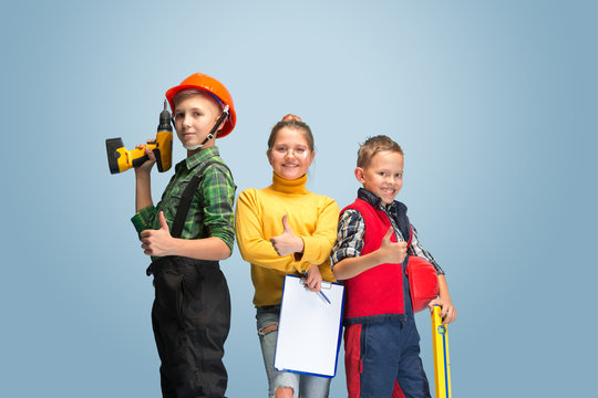 First step. Kids dreaming about profession of engineer. Childhood, planning, education and dream concept. Want to become successful employee in manufacturing, building industry, infrastructure.