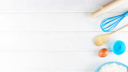 Top view photo with Kitchen Utensils on white vintage, natural, wooden background. Space for text.