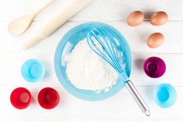 Top view photo with Kitchen Utensils on white vintage, natural, wooden background.