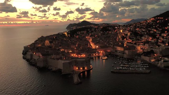 Aerial view of Old Town, Dubrovnik City, Croatia. Drone footage shot at night showing the historical town.