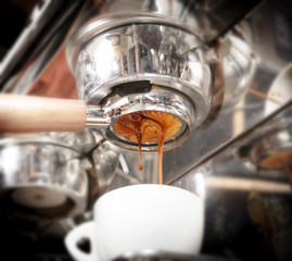 Fototapeta na wymiar Making espresso coffee in coffeeshop or cafe closeup