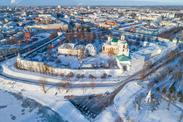 Obraz premium The old Transfiguration Monastery in the cityscape on a sunny January day (aerial photography). Yaroslavl, Golden Ring of Russia
