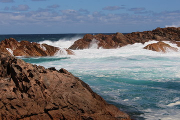 waterspray behind rocks