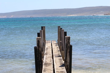 wooden jetty near coastline
