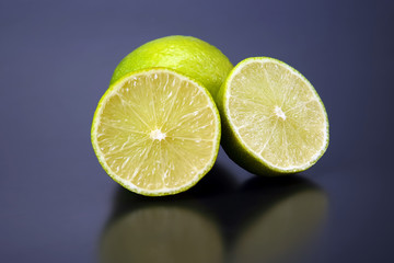 Citrus fruits. cut in half lemons on a gray background