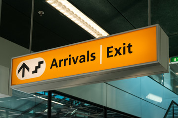 Arrivals and Exit sign closeup on airport -