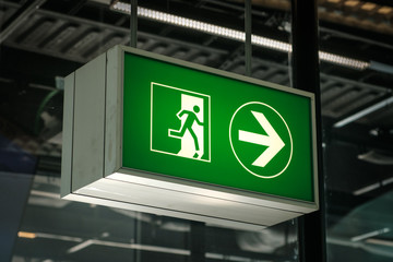 Emergency Exit sign on airport closeup -
