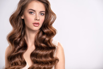 Portrait of a beautiful woman with a long brown hair.