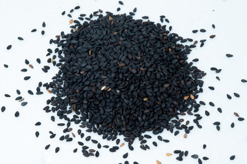 Pile of black sesame seeds isolated on white background. No people.
