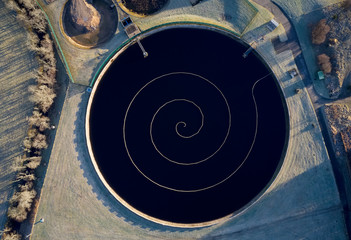 Sewage water works treatment plant aerial view from above showing waste quality round circular...