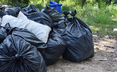 Garbage bags and trash on the street. Pollution concept