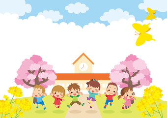Obraz na płótnie Canvas 桜咲く春の幼稚園の前で元気にジャンプするキッズ