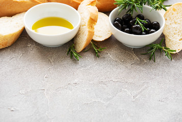 Sliced fresh crusty baguette with olive and spices