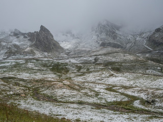 The little hill of St. Bernard in Val D`aosta on a foggy day, alpine pass between Italy and France