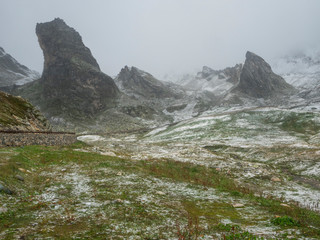 The little hill of St. Bernard in Val D`aosta on a foggy day, alpine pass between Italy and France