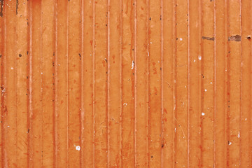 detail of orange metal garage door texture; metal background