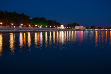 A quiet, warm southern city, on the beach, in the night city lights. A great place to relax.